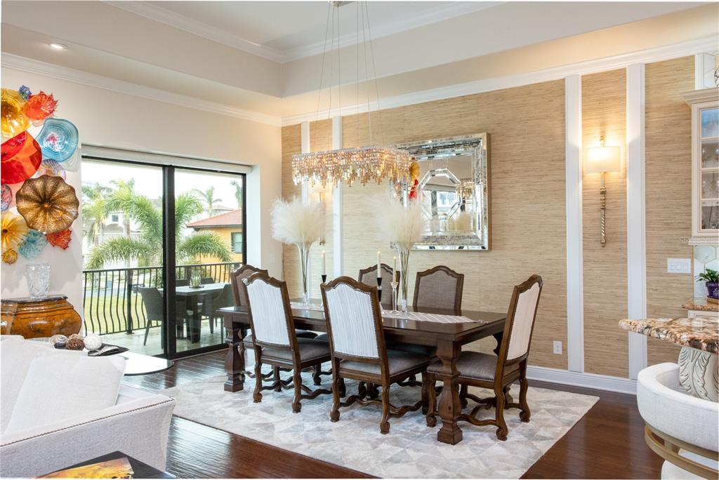 105 Wimbledon Court Redington Shores, FL 33708 - Photo 15 of 64 a view of a dining room with furniture window and outside view