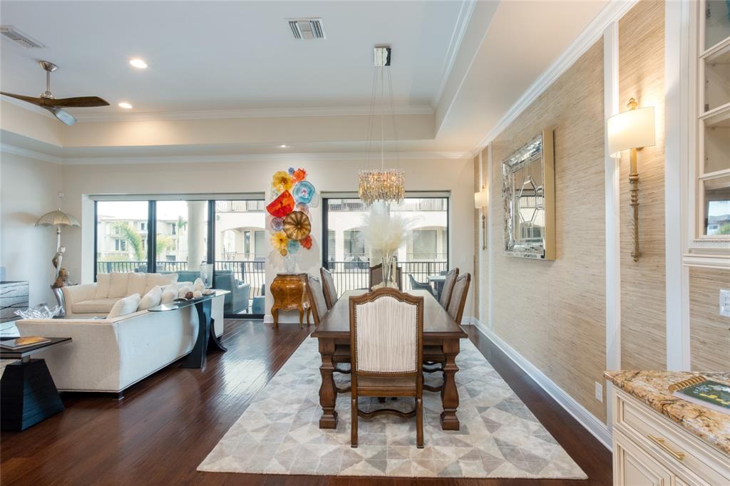 105 Wimbledon Court Redington Shores, FL 33708 - Photo 16 of 64 a living room with furniture and wooden floor