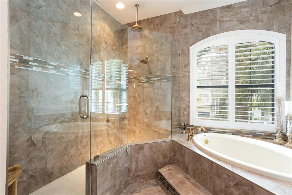 105 Wimbledon Court Redington Shores, FL 33708 - Photo 30 of 64 a bathroom with a bathtub and a shower