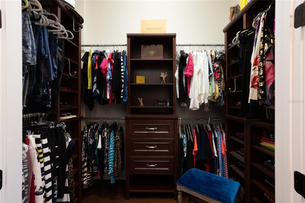 105 Wimbledon Court Redington Shores, FL 33708 - Photo 31 of 64 a view of walk in closet with clothes and shoes
