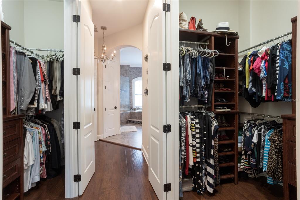 105 Wimbledon Court Redington Shores, FL 33708 - Photo 32 of 64 a view of walk in closet with clothes and shoes