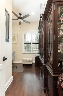 a bathroom with a toilet and a mirror