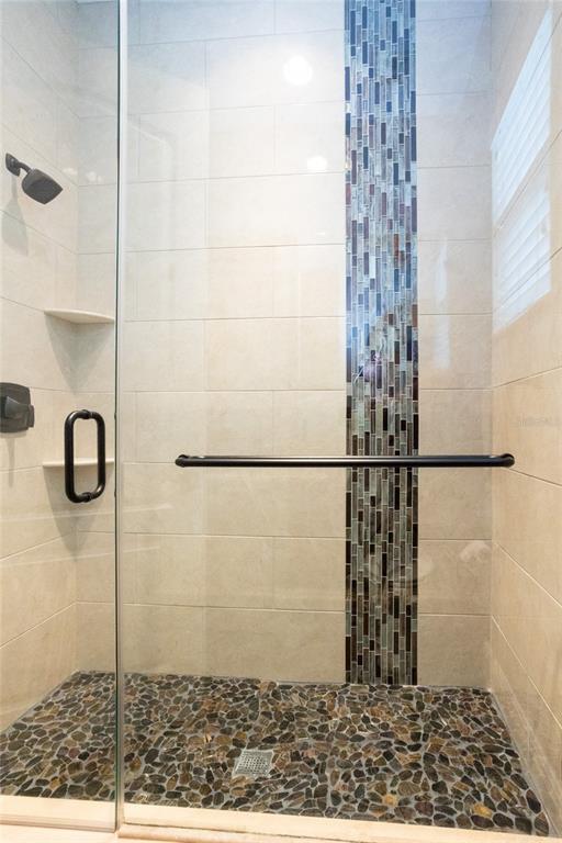 105 Wimbledon Court Redington Shores, FL 33708 - Photo 36 of 64 a bathroom with a shower