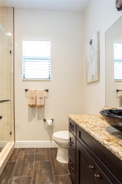 105 Wimbledon Court Redington Shores, FL 33708 - Photo 37 of 64 a bathroom with a granite countertop sink toilet and shower