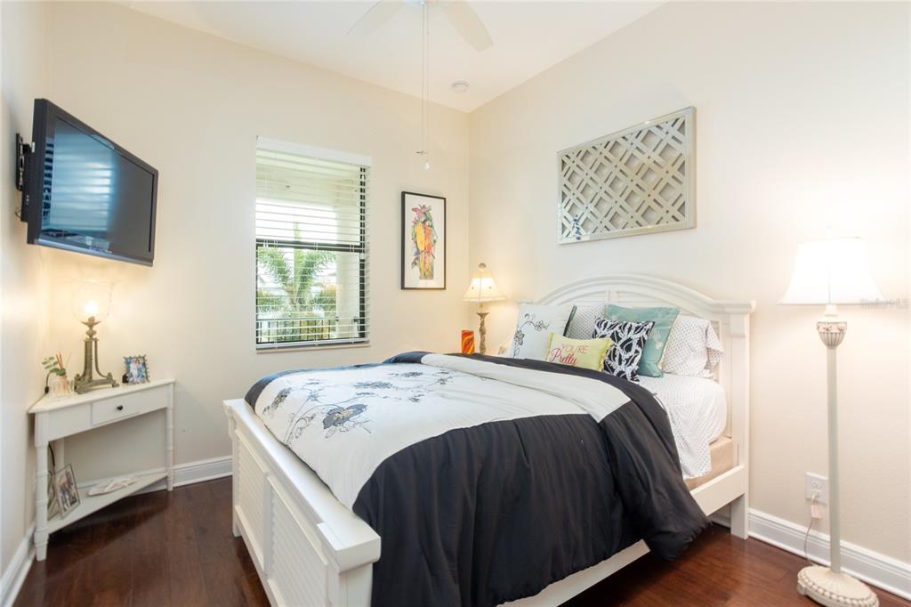 105 Wimbledon Court Redington Shores, FL 33708 - Photo 41 of 64 a bedroom with a bed and a window