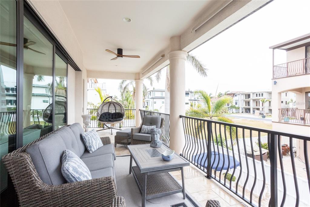 105 Wimbledon Court Redington Shores, FL 33708 - Photo 45 of 64 a living room with furniture and a large window