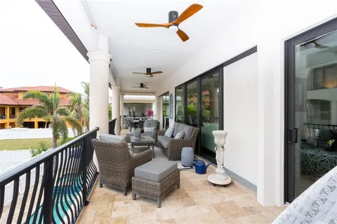 a view of a patio with table and chairs potted plants