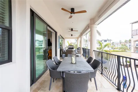 a view of dinning table and chairs in the balcony