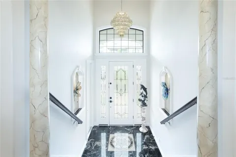 a view of a living room and kitchen