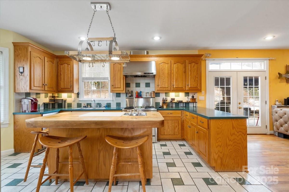 4594 Grandin Road Lenoir, NC 28645 - Photo 12 of 44 a dining table chairs and a chandelier