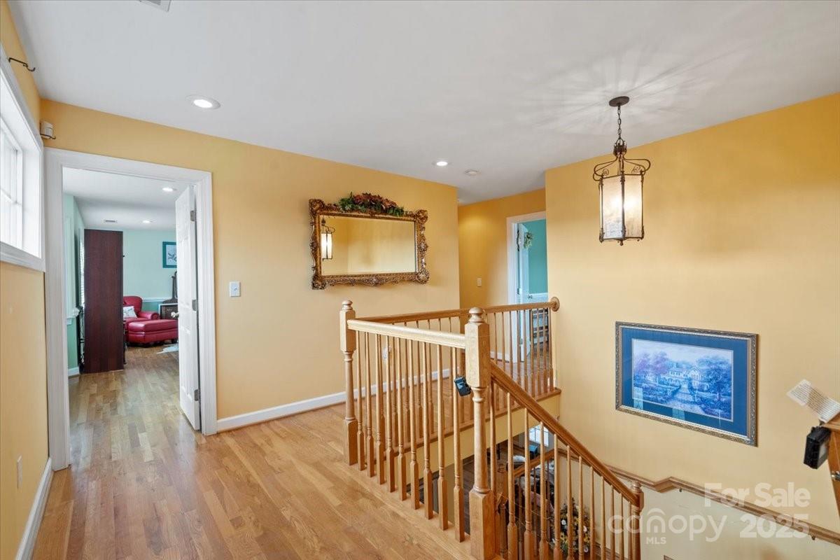 4594 Grandin Road Lenoir, NC 28645 - Photo 15 of 44 a view of hallway with livingroom and wooden floor