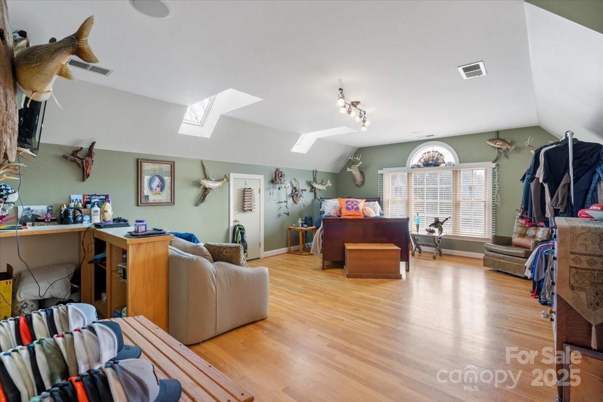 4594 Grandin Road Lenoir, NC 28645 - Photo 16 of 44 a living room with furniture and a book shelf