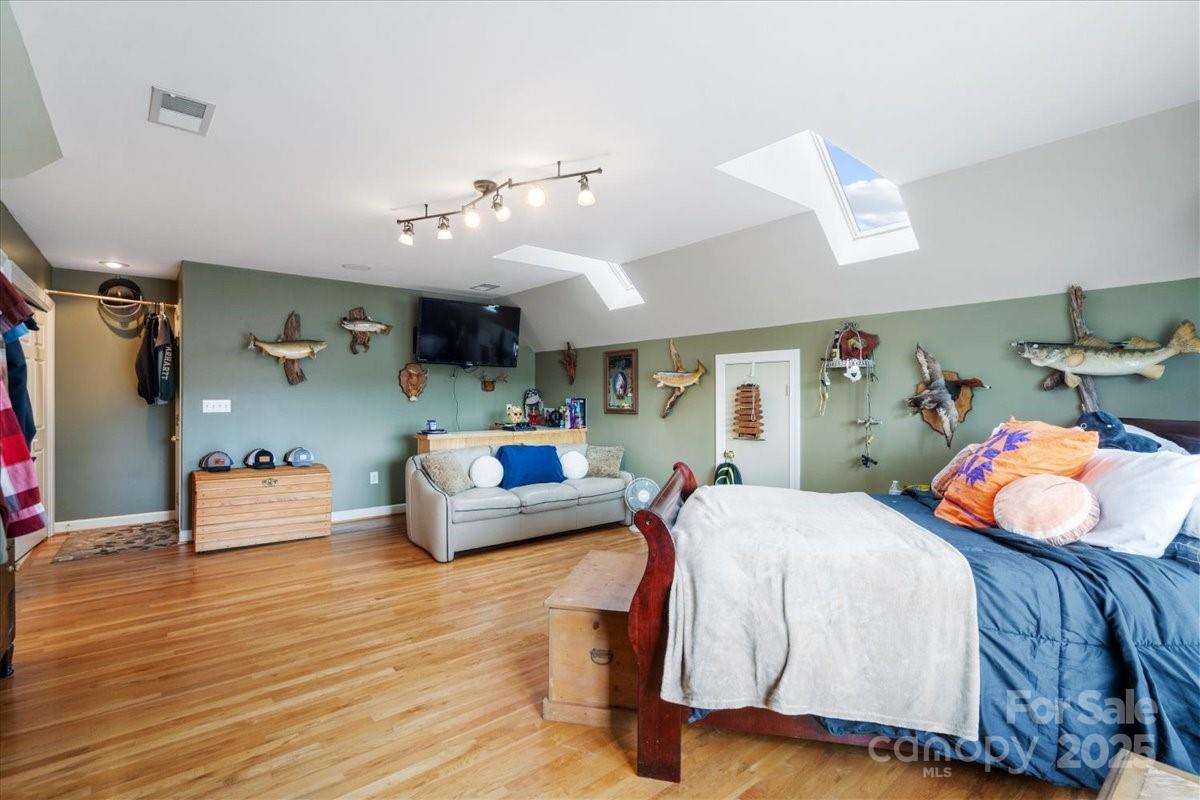 4594 Grandin Road Lenoir, NC 28645 - Photo 17 of 44 a bedroom with furniture and a wooden floor