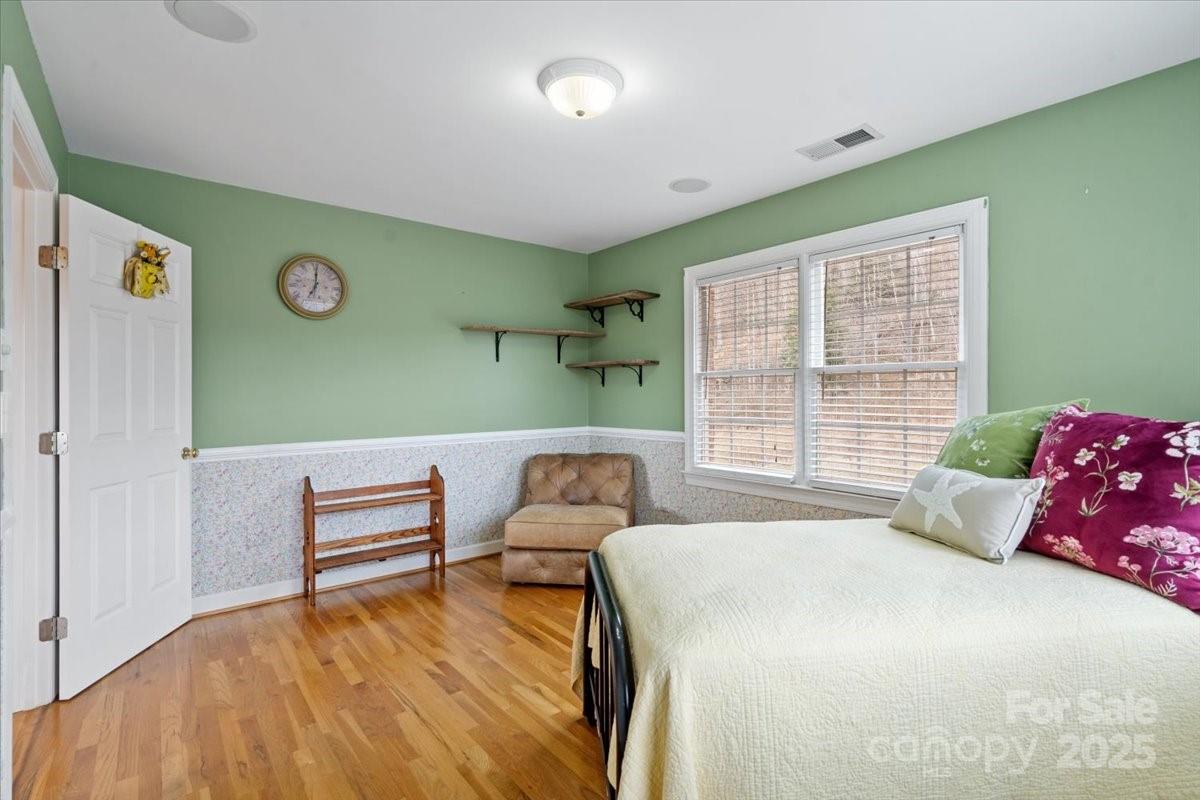 4594 Grandin Road Lenoir, NC 28645 - Photo 21 of 44 a bedroom with furniture and a window