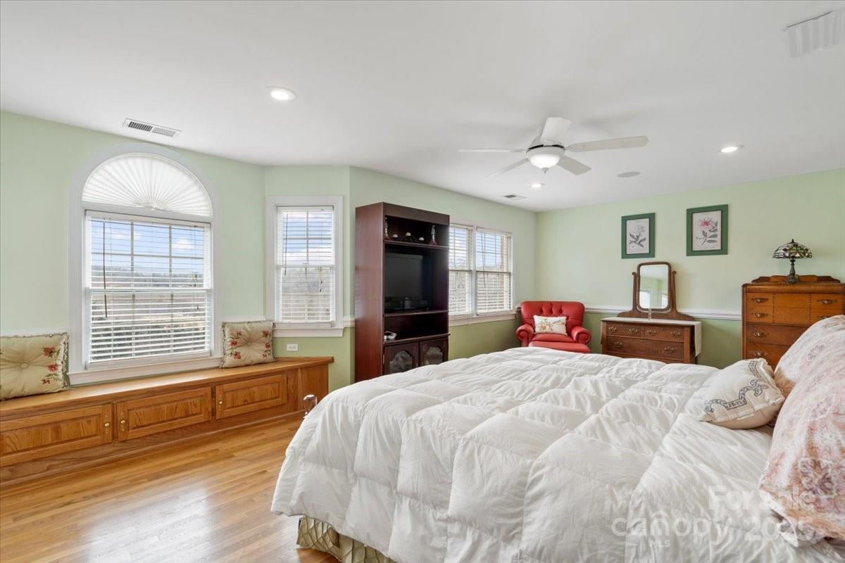 4594 Grandin Road Lenoir, NC 28645 - Photo 23 of 44 a bedroom with a large bed and a large window