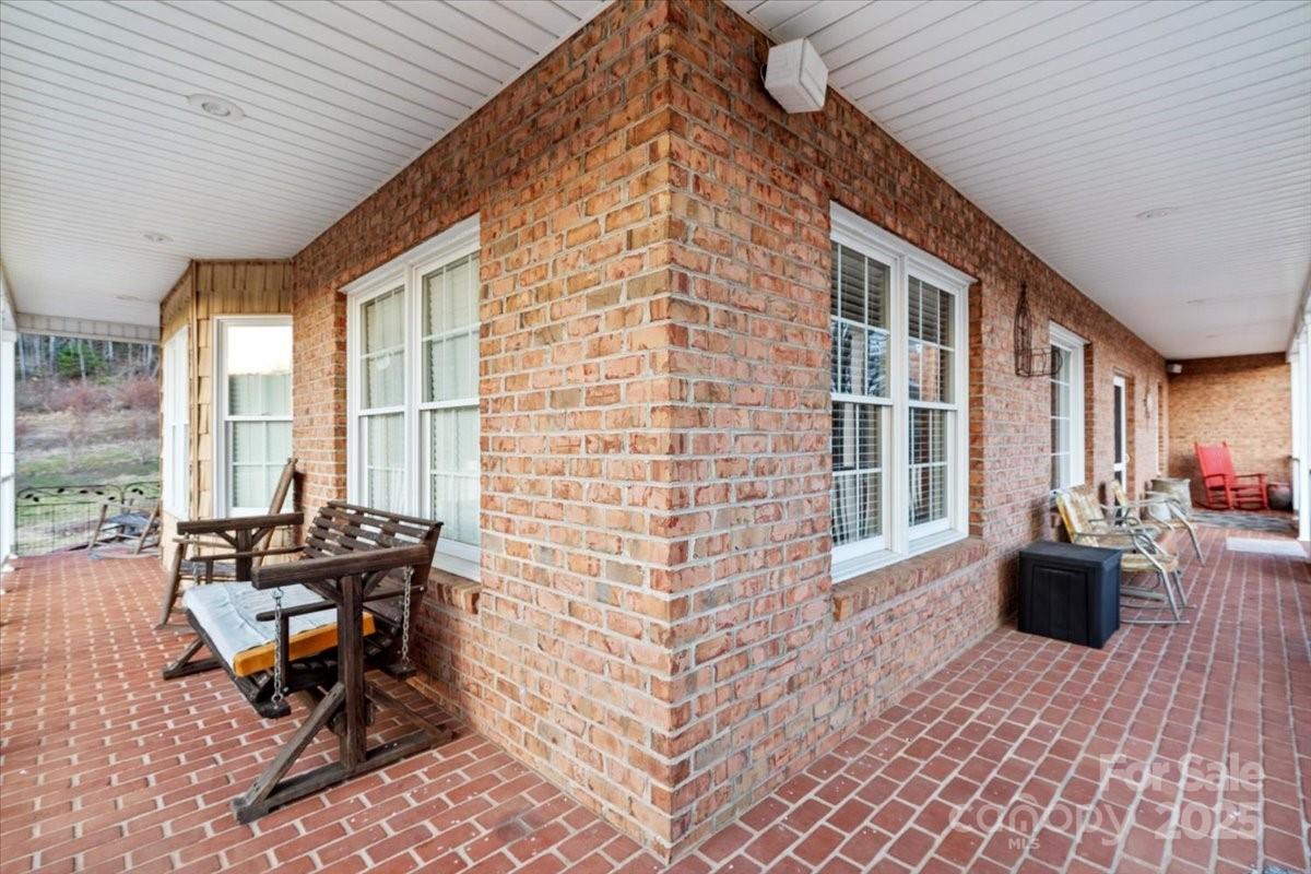 4594 Grandin Road Lenoir, NC 28645 - Photo 35 of 44 a backyard of a house with outdoor seating