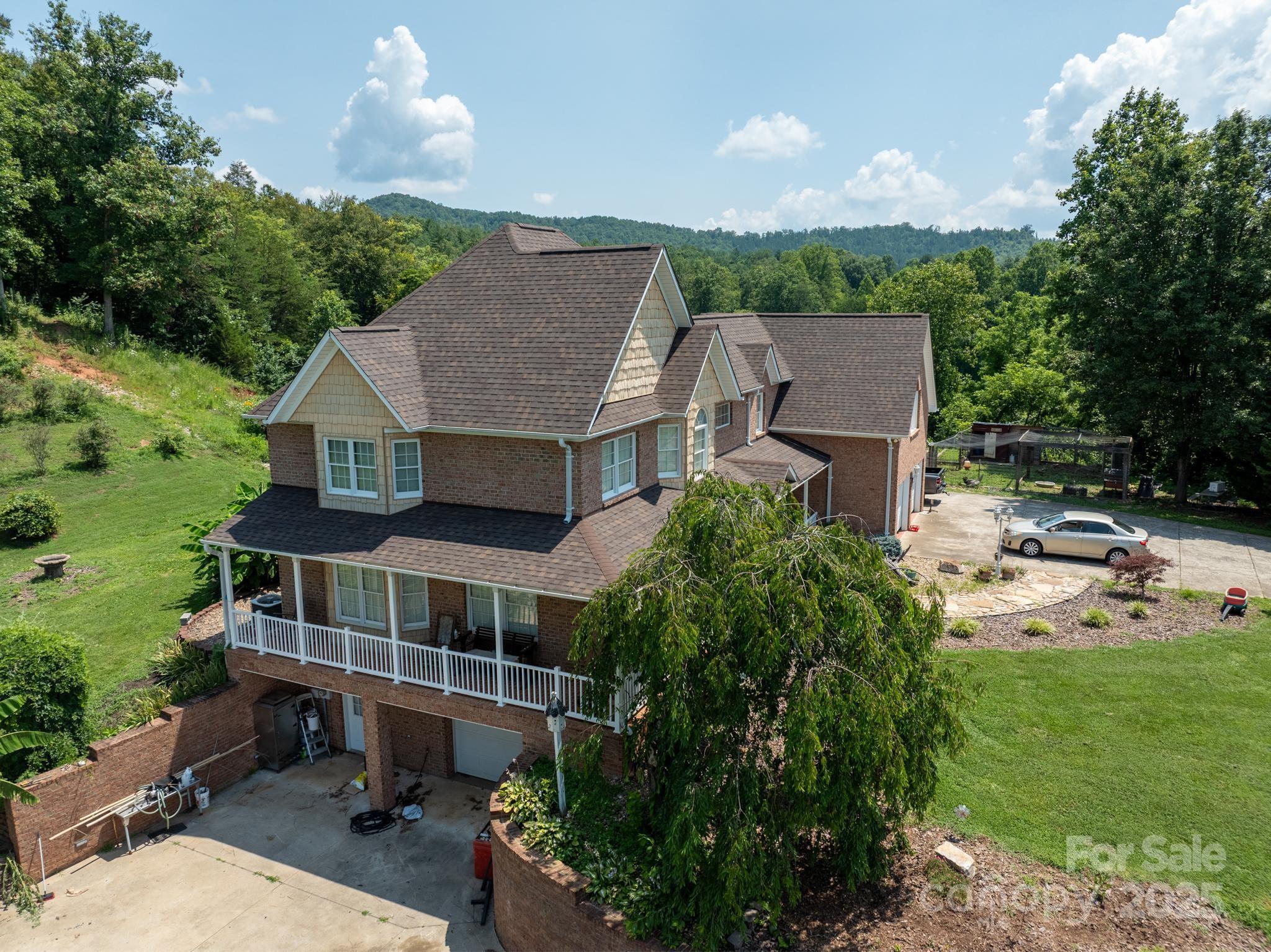 4594 Grandin Road Lenoir, NC 28645 - Photo 42 of 44 an aerial view of a house with swimming pool garden and patio
