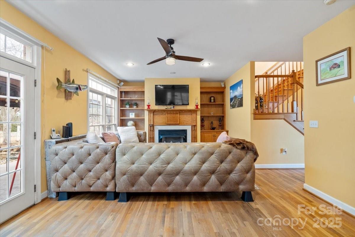 4594 Grandin Road Lenoir, NC 28645 - Photo 9 of 44 a living room with furniture fireplace and flat screen tv