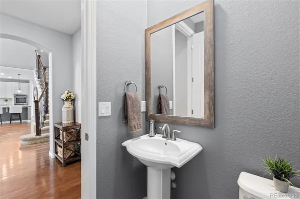 a bathroom with a sink a mirror and shower
