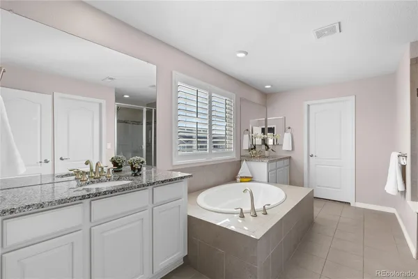 a bath room with sink and mirror