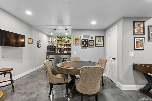 a view of a hallway with paintings on the wall