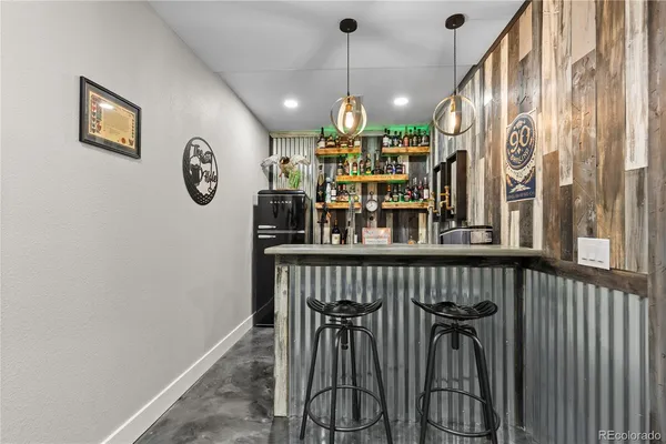 a kitchen with a sink and a refrigerator