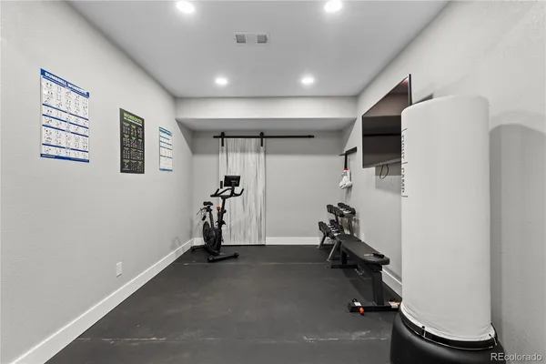 a bed room with a bed and a television