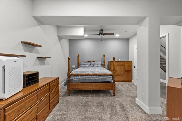 a bathroom with a sink toilet vanity and shower