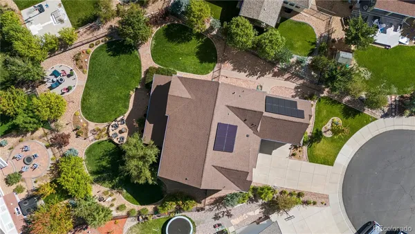 an aerial view of a house with a garden