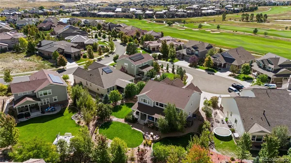 a house view with a seating space and garden