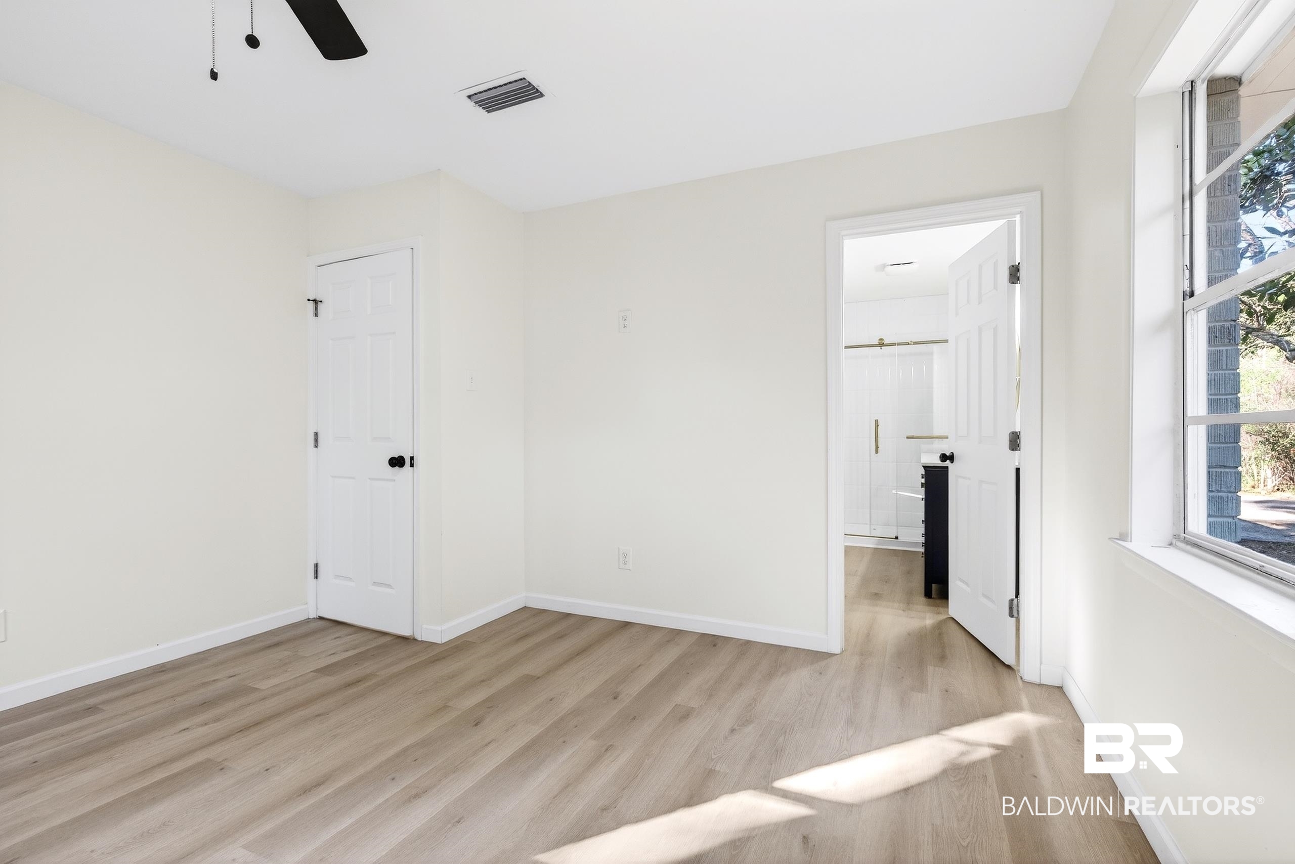 30902 Stanton Road Spanish Fort, AL 36527 - Photo 12 of 27 Unfurnished room with ceiling fan and light wood-type flooring