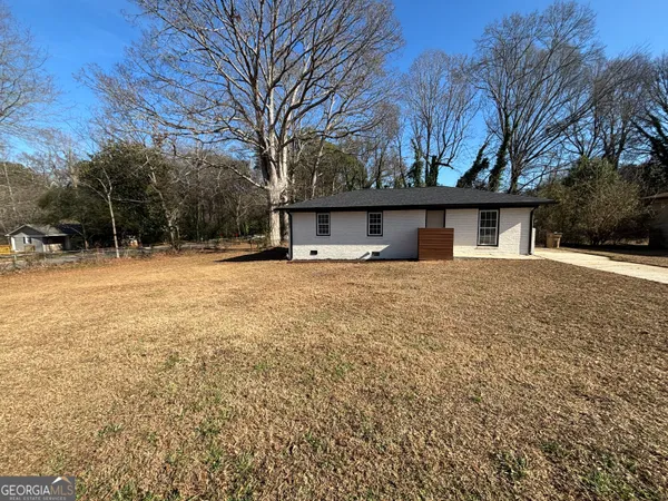 a house with trees in front of it