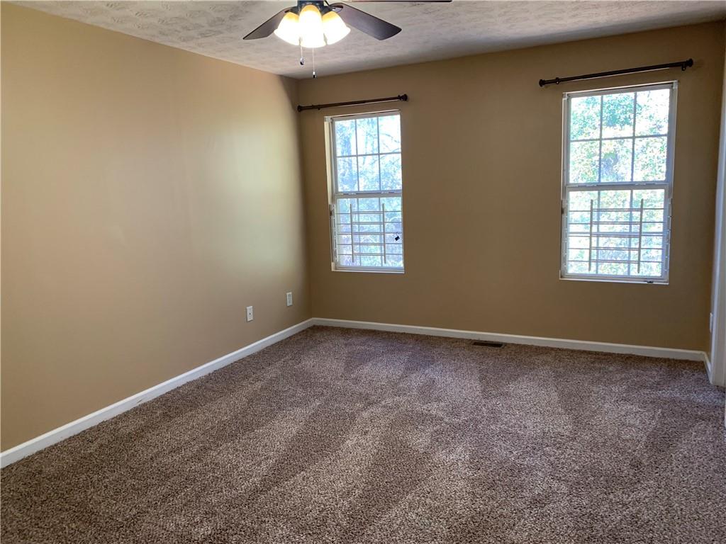 2195 Clayton Ridge Lithonia, GA 30058 - Photo 12 of 23 an empty room with windows