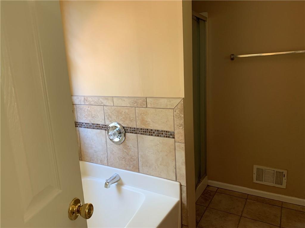 2195 Clayton Ridge Lithonia, GA 30058 - Photo 15 of 23 a bathroom with a tub
