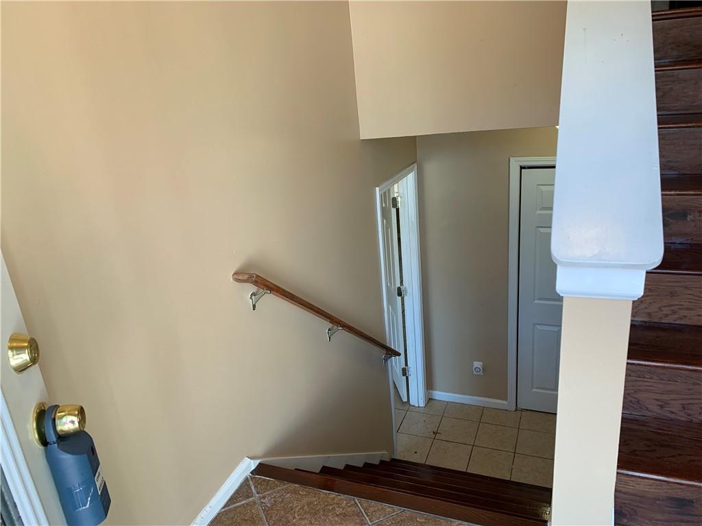 2195 Clayton Ridge Lithonia, GA 30058 - Photo 3 of 23 a view of staircase with white walls