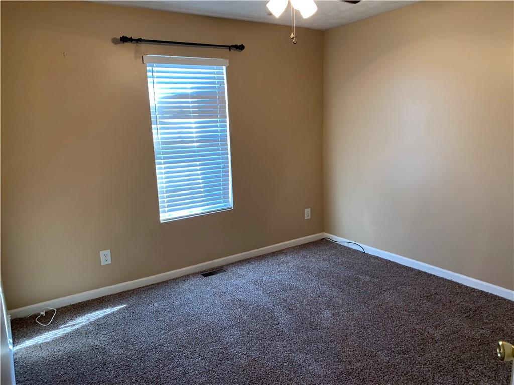 2195 Clayton Ridge Lithonia, GA 30058 - Photo 9 of 23 an empty room with a window