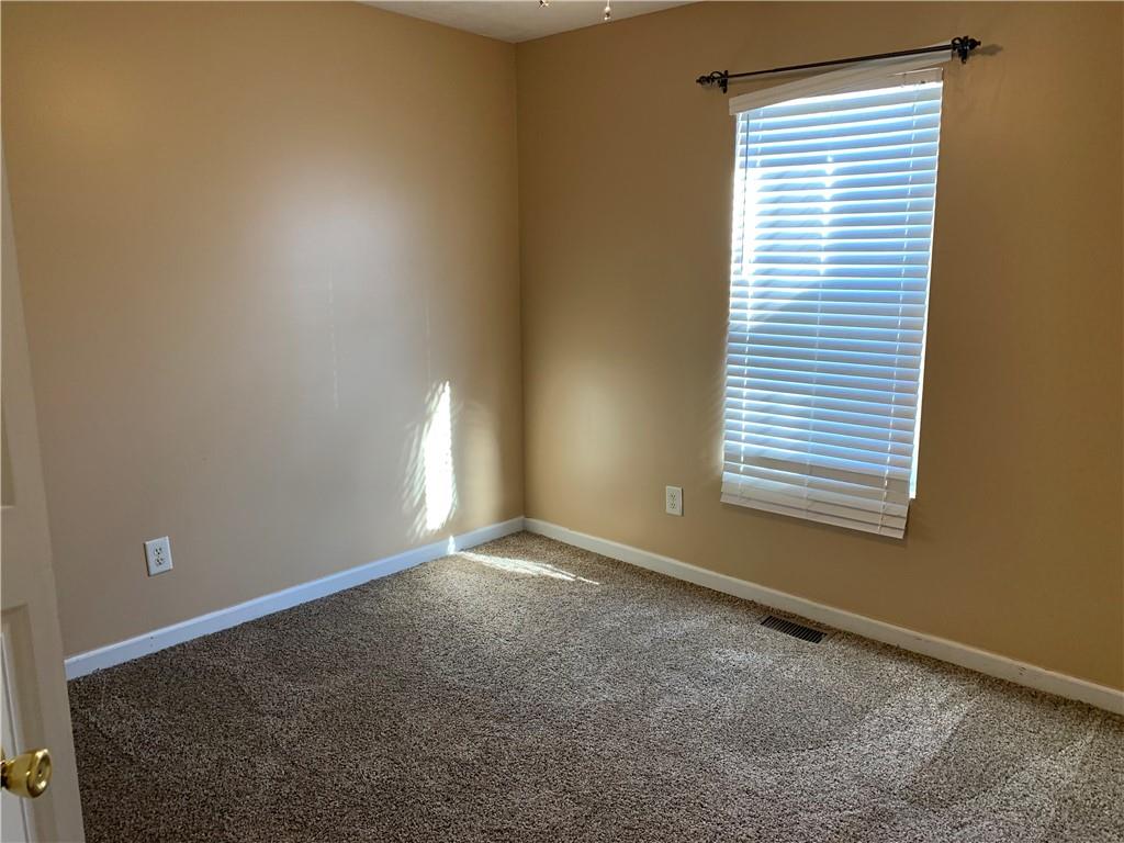 2195 Clayton Ridge Lithonia, GA 30058 - Photo 10 of 23 a view of an empty room with a window