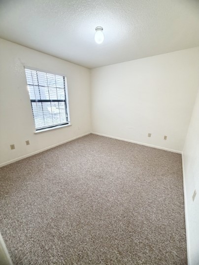 728 West San Antonio Street, Unit 728A Lockhart, TX 78644 - Photo 11 of 12 an empty room with a window