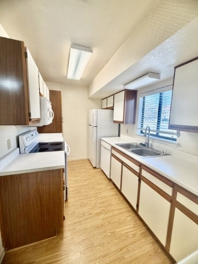 728 West San Antonio Street, Unit 728A Lockhart, TX 78644 - Photo 6 of 12 a large kitchen with kitchen island a sink stainless steel appliances and cabinets