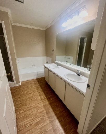 728 West San Antonio Street, Unit 728A Lockhart, TX 78644 - Photo 8 of 11 a bathroom with a sink and a bathtub