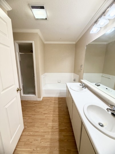 728 West San Antonio Street, Unit 728A Lockhart, TX 78644 - Photo 9 of 12 a bathroom with a double vanity sink and mirror
