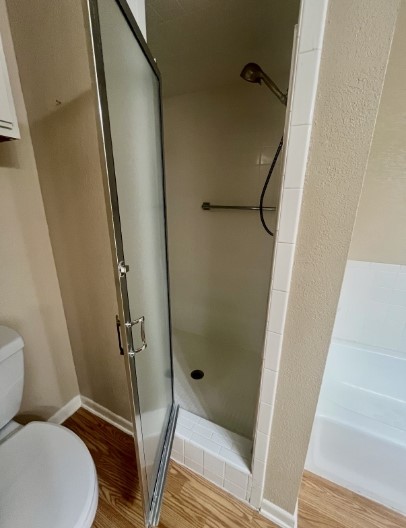 728 West San Antonio Street, Unit 728A Lockhart, TX 78644 - Photo 10 of 11 a bathroom with a shower and toilet