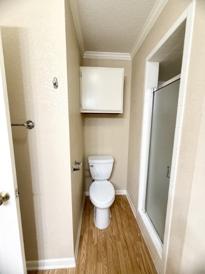 728 West San Antonio Street, Unit 728A Lockhart, TX 78644 - Photo 10 of 12 a bathroom with a toilet and a sink