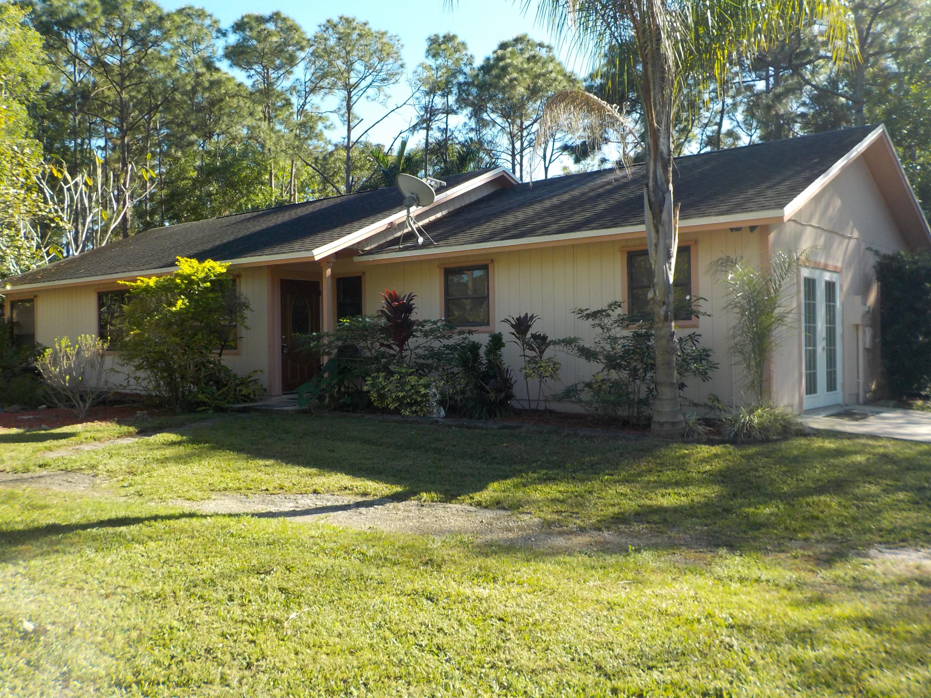 13882 153rd Road North Jupiter, FL 33478 - Photo 1 of 23 Front House View