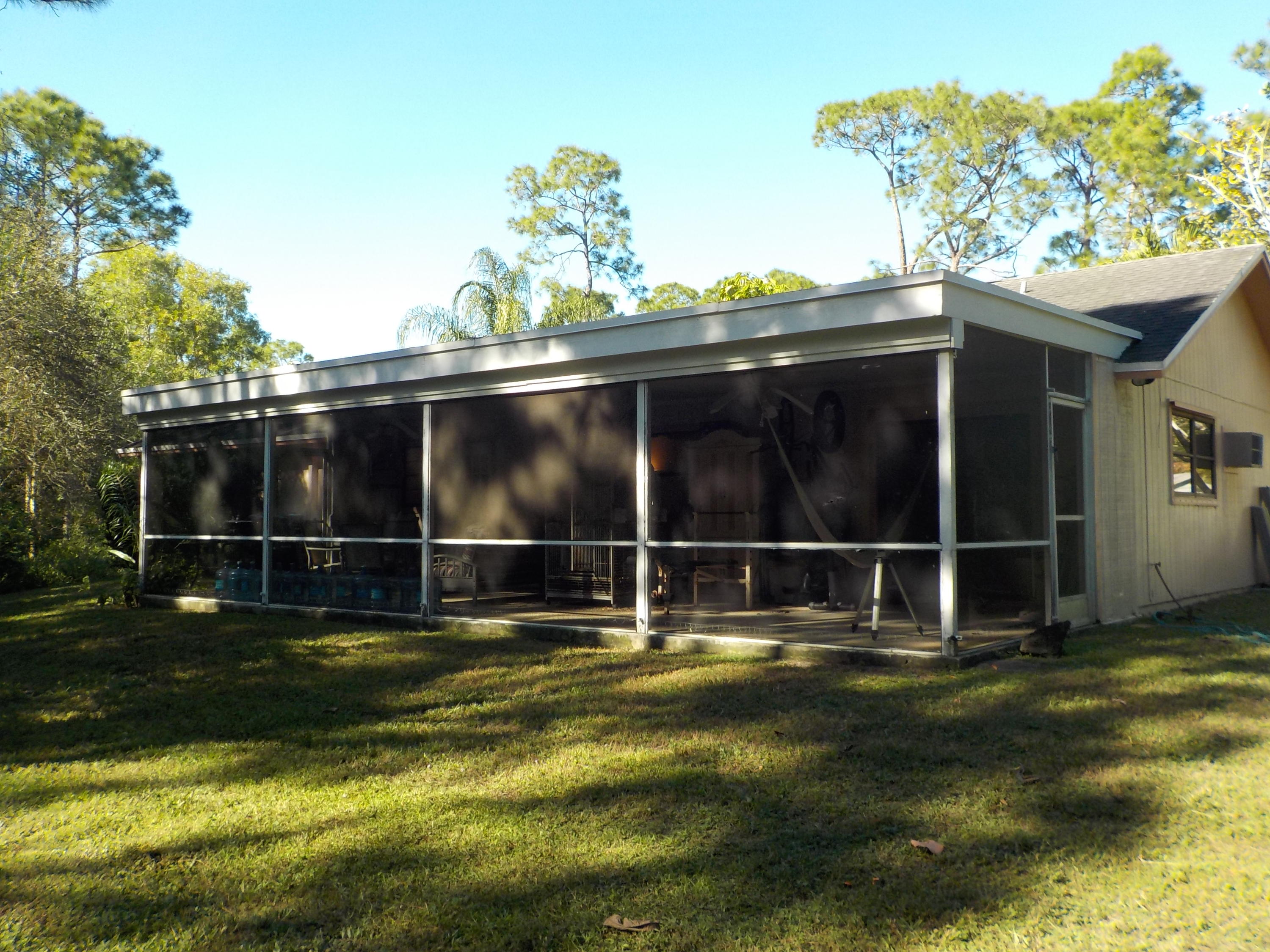 13882 153rd Road North Jupiter, FL 33478 - Photo 18 of 23 Covered Patio