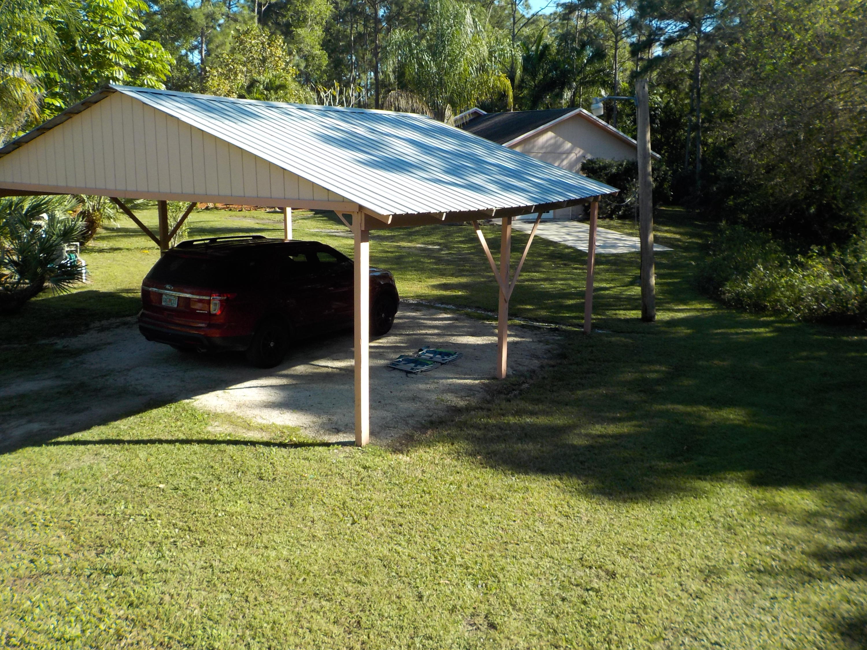13882 153rd Road North Jupiter, FL 33478 - Photo 19 of 23 Elevated Carport