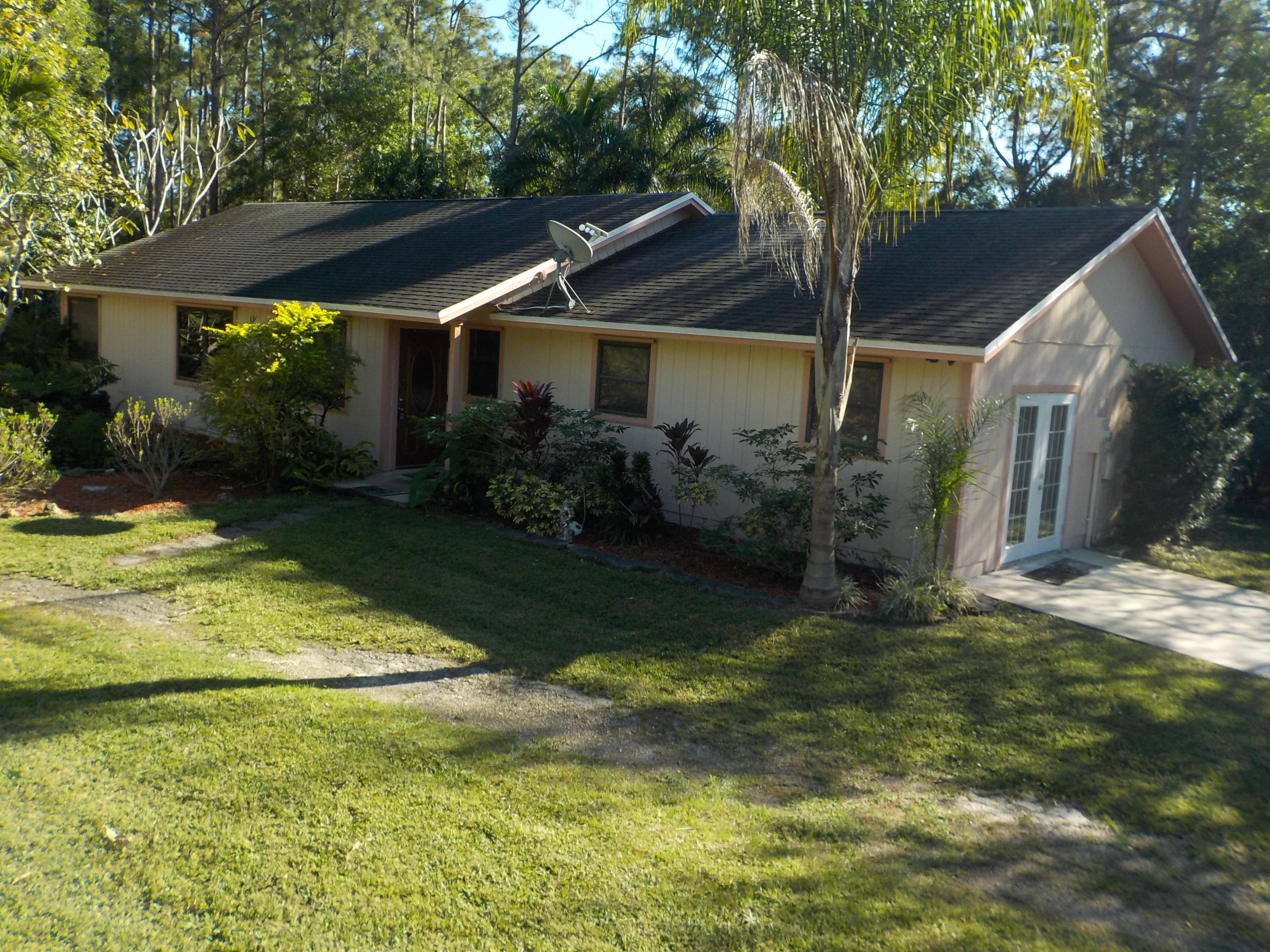 13882 153rd Road North Jupiter, FL 33478 - Photo 20 of 23 Front of House Elevated View