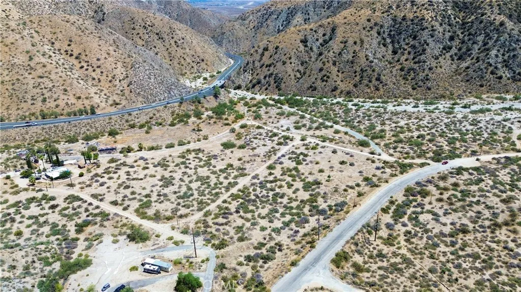 1 Canyon House Road Moreno Valley, CA 92553 - Photo 8 of 11 a view of a dry plant plant in a yard