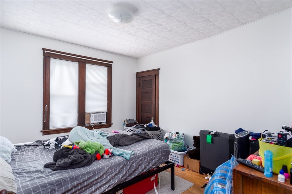 63 Pilgrim Avenue Worcester, MA 01604 - Photo 12 of 23 a bed room with furniture and a window