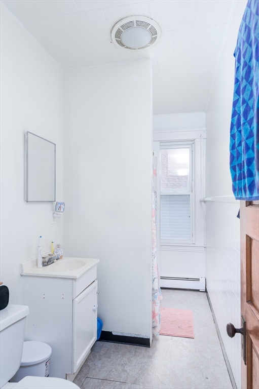 63 Pilgrim Avenue Worcester, MA 01604 - Photo 14 of 23 a bathroom with a sink toilet and vanity